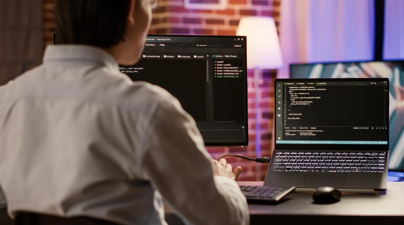 Specialist at a computer reviewing how aml software connects inside a gaming platform